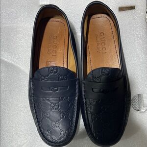 Gucci Men's Embossed Black Leather Loafers